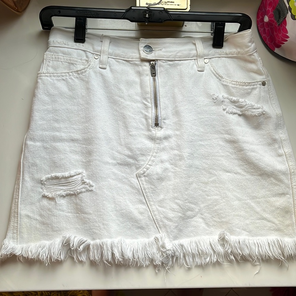 White denim skirt distressed